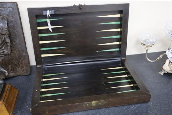 An early 19th century ebony and boxwood travelling games box, 23 x 13.5in.